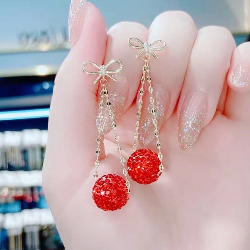 Gold Bow Drop Earrings with Red Stones