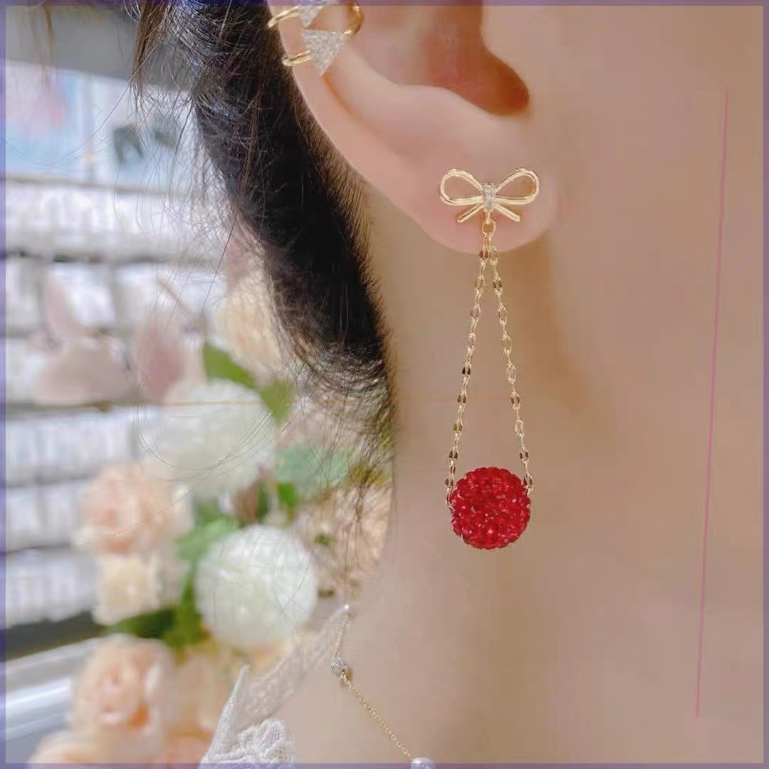 Gold Bow Drop Earrings with Red Stones