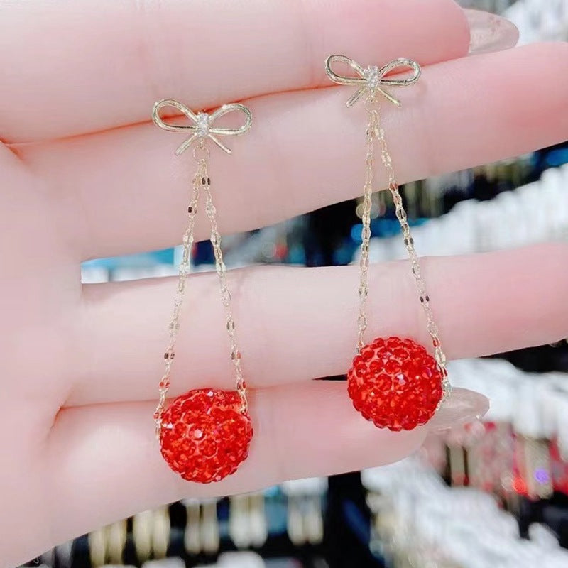Gold Bow Drop Earrings with Red Stones